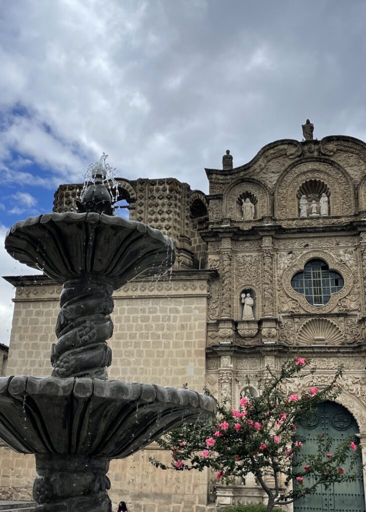 The fountain flowing in the plaza in front of the church of Belen
