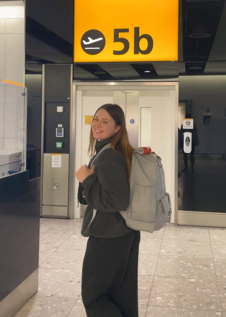 Megan in airport with her backpack on