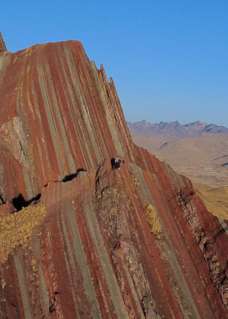 A drone photo of Megan and Dan stood at the viewpoint on the jagged edge of Pallay Punchu. 