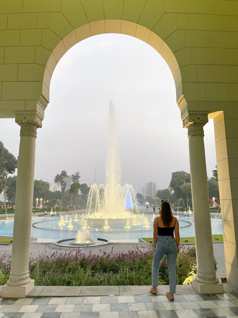 Megan looking on to one of the fountains in the Park of the Reserve