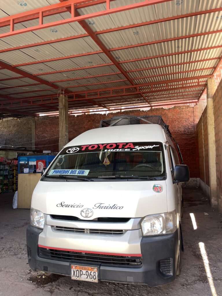 A Combi (van) parked in the station waiting to go to Layo.