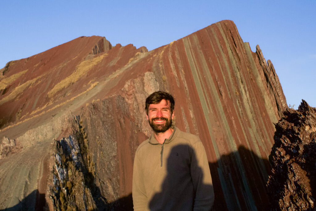 Dan stood in front of Pallay Punchu at the viewpoint during golden hour. 