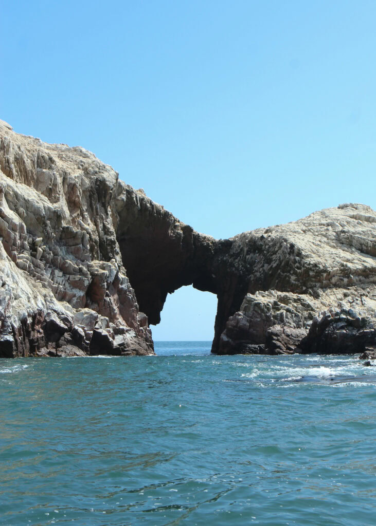 A rocky arch in the sea nearby Isla Blanca 