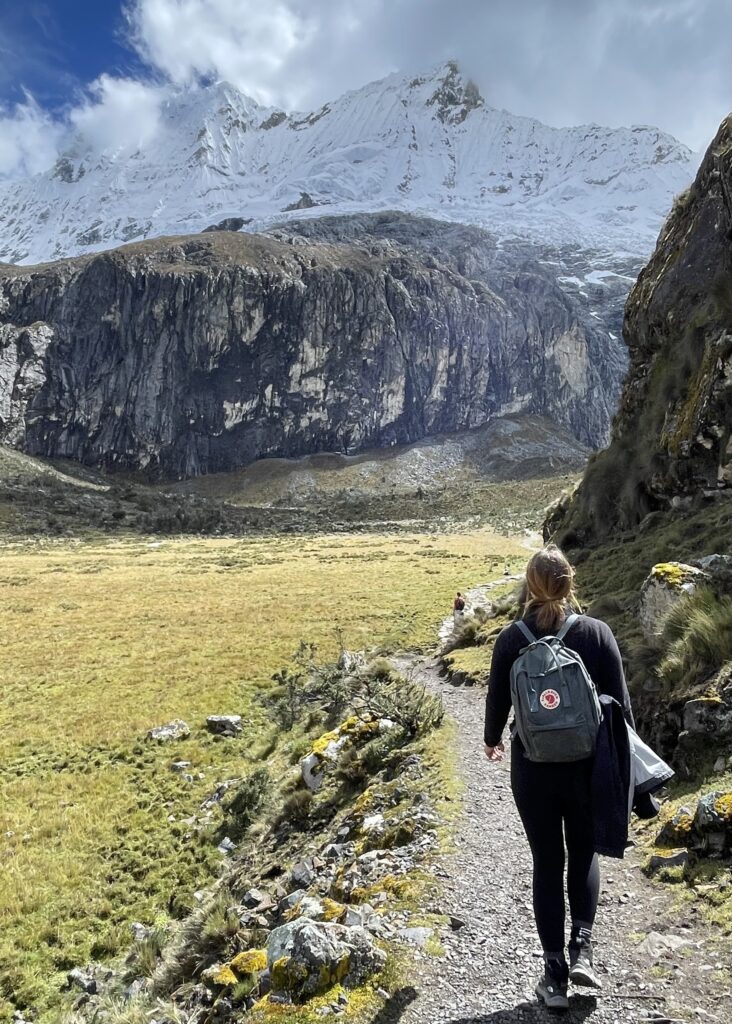 Megan in the grassy meadow on the third section of the Laguna 69 hike when it flattens out for a short while. 